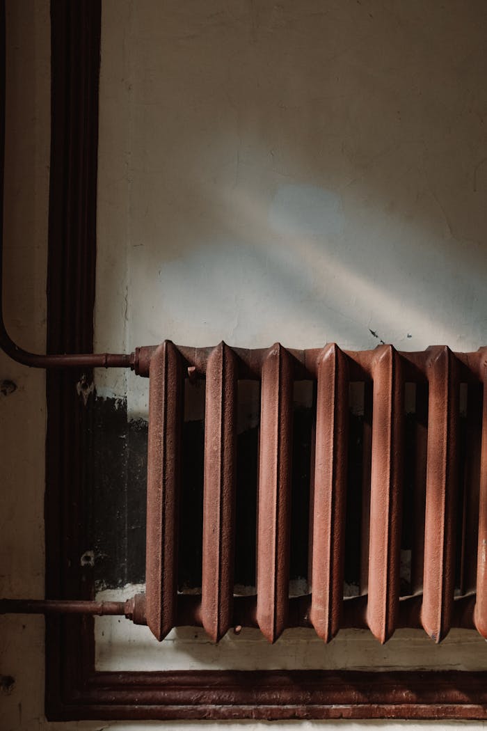rusty steam radiator on wall 4752984